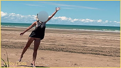 Wife plays football nude at public clothed beach Thumb