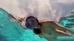 Hot brunette slut Candy swims underwater Thumb